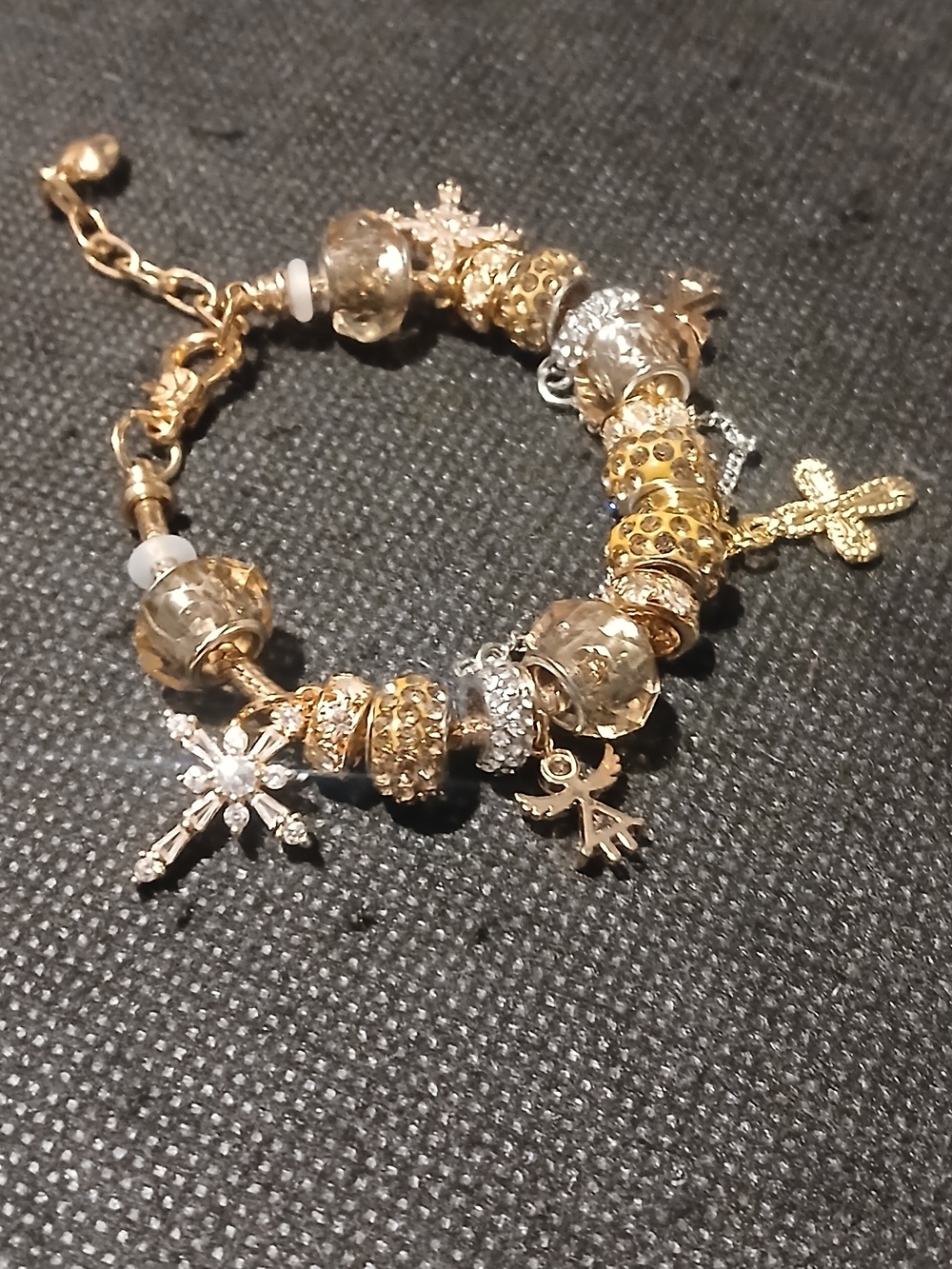 Trinket Shop -Gold Colored Bangle Bracket, Man Made Diamonds on Crosses & Angels